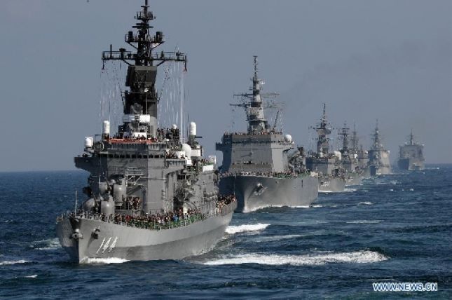 Japan's Maritime Self-Defense Force (MSDF) ships sail during a fleet review off Sagami Bay, Kanagawa prefecture, on Oct. 18, 2015.