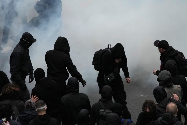 Clashes erupt across France as police assault record protests to defend pensions